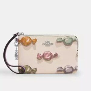 Corner Zip Wristlet With Candy Print And Charm